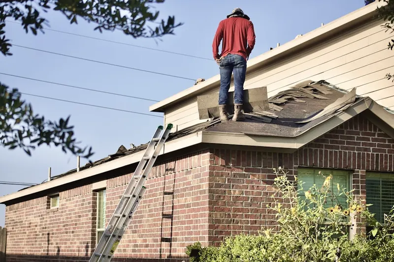 Professional roofer working on a residential roof in Downtown Pataskala